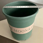 Green plastic planter pot with MOONRI label, open top and textured rim